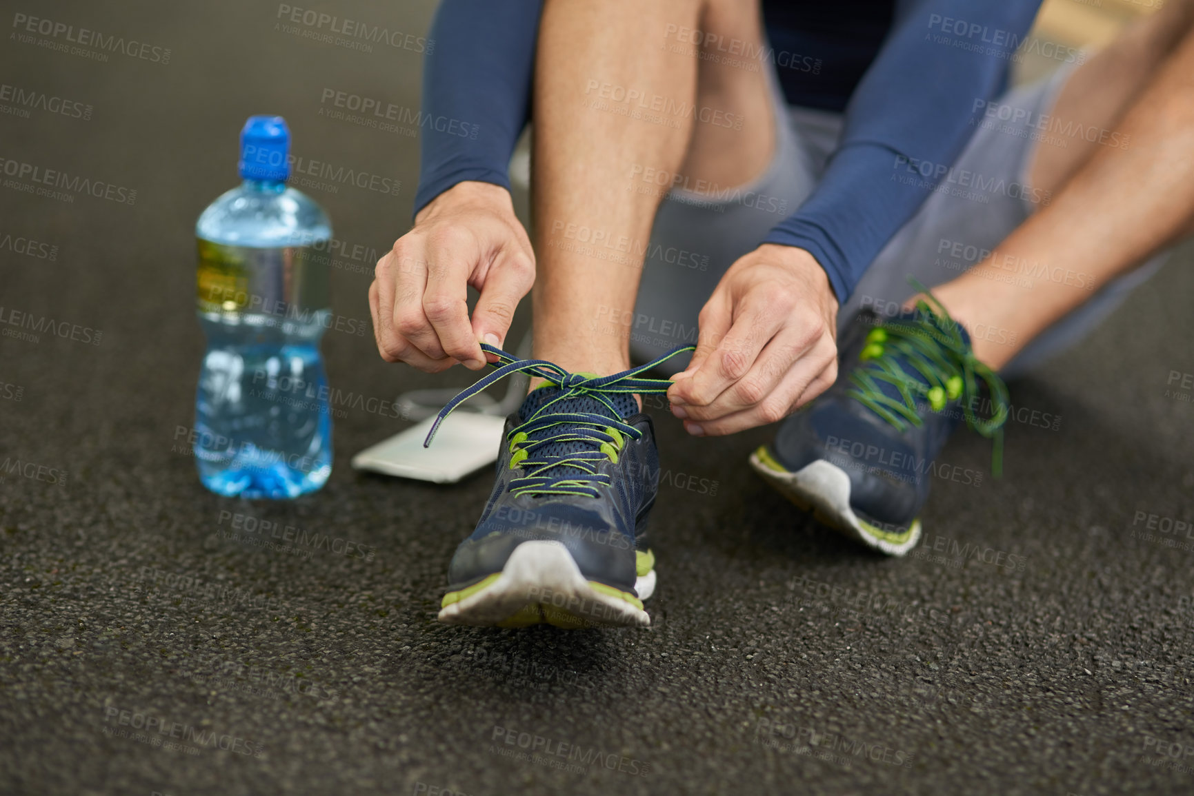 Buy stock photo Man, hands and tying shoes with water for fitness, workout preparation or training on floor at gym. Closeup, male person or runner with tie, sneakers or getting ready for running, cardio or health