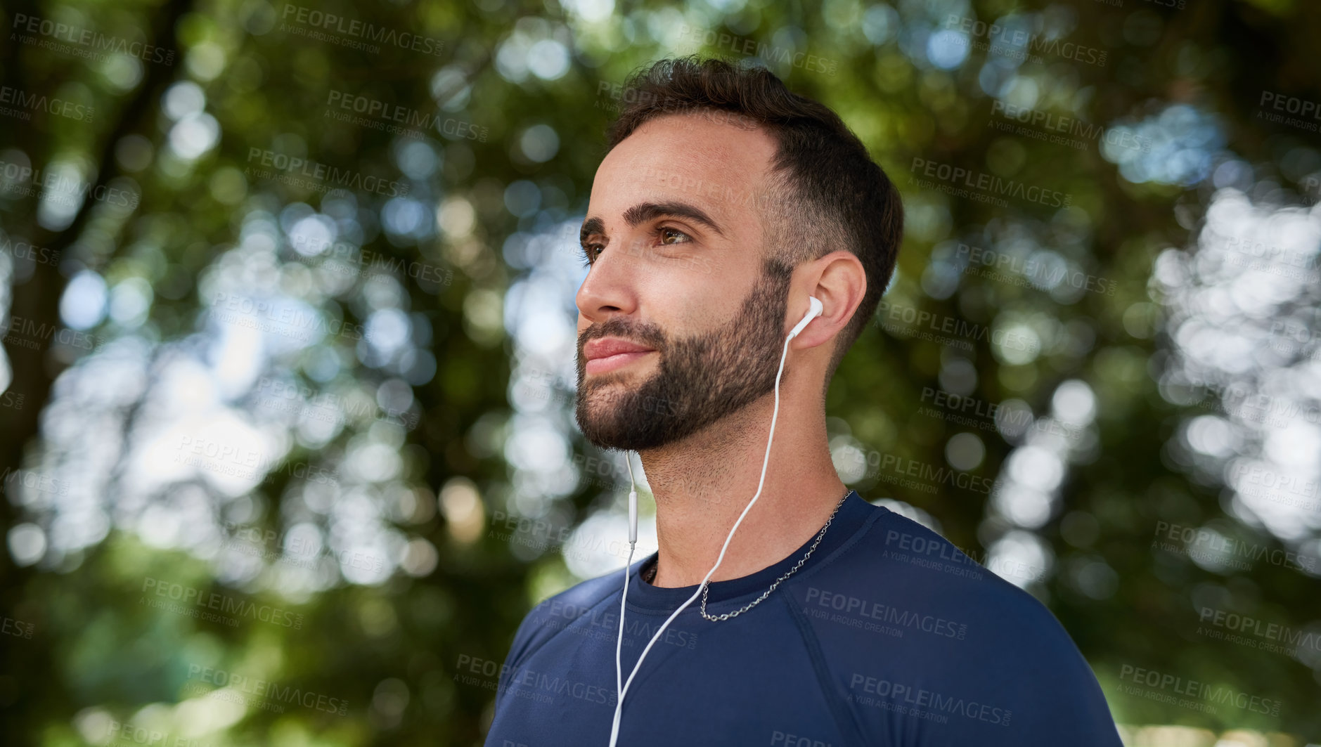 Buy stock photo Thinking, fitness and man in nature with earphones for listening to music, podcast or radio. Sports, workout and male athlete with audio tech for streaming cardio playlist for running at outdoor park