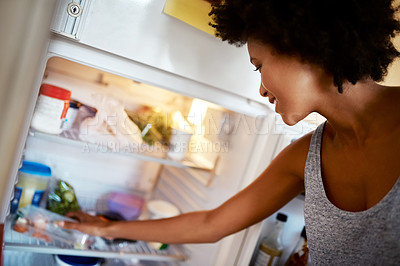 Buy stock photo Woman, search fridge and food with smile, hungry and thinking for diet, meal and choice in home kitchen. Young african girl, happy and decision for breakfast, lunch or dinner in house for nutrition