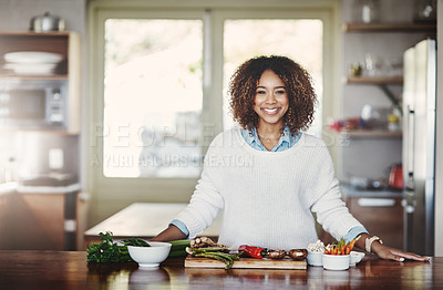 Buy stock photo Health, wellness and food of a healthy lifestyle, portrait of happy black woman cooking in a kitchen. African American nutritionist making a healthy balanced meal with organic superfoods at home