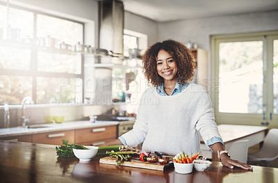 Buy stock photo Wellness, cooking and a healthy lifestyle at home with a happy woman starting a weight loss journey. Portrait of a female smiling preparing a nutritious meal with organic vegetables in a kitchen