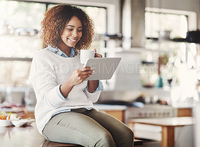 Buy stock photo Woman, tablet and smile with coffee in kitchen for communication, break and social media post. Technology, female person and drink browsing internet for online news, reading blog or research in home