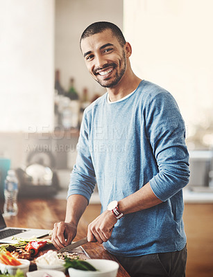 Buy stock photo Cooking, meal and man with knife for vegetables, food and dinner in home. Vegan, diet and healthy eating with portrait and recipe for nutrition, smile and male person in kitchen with ingredients