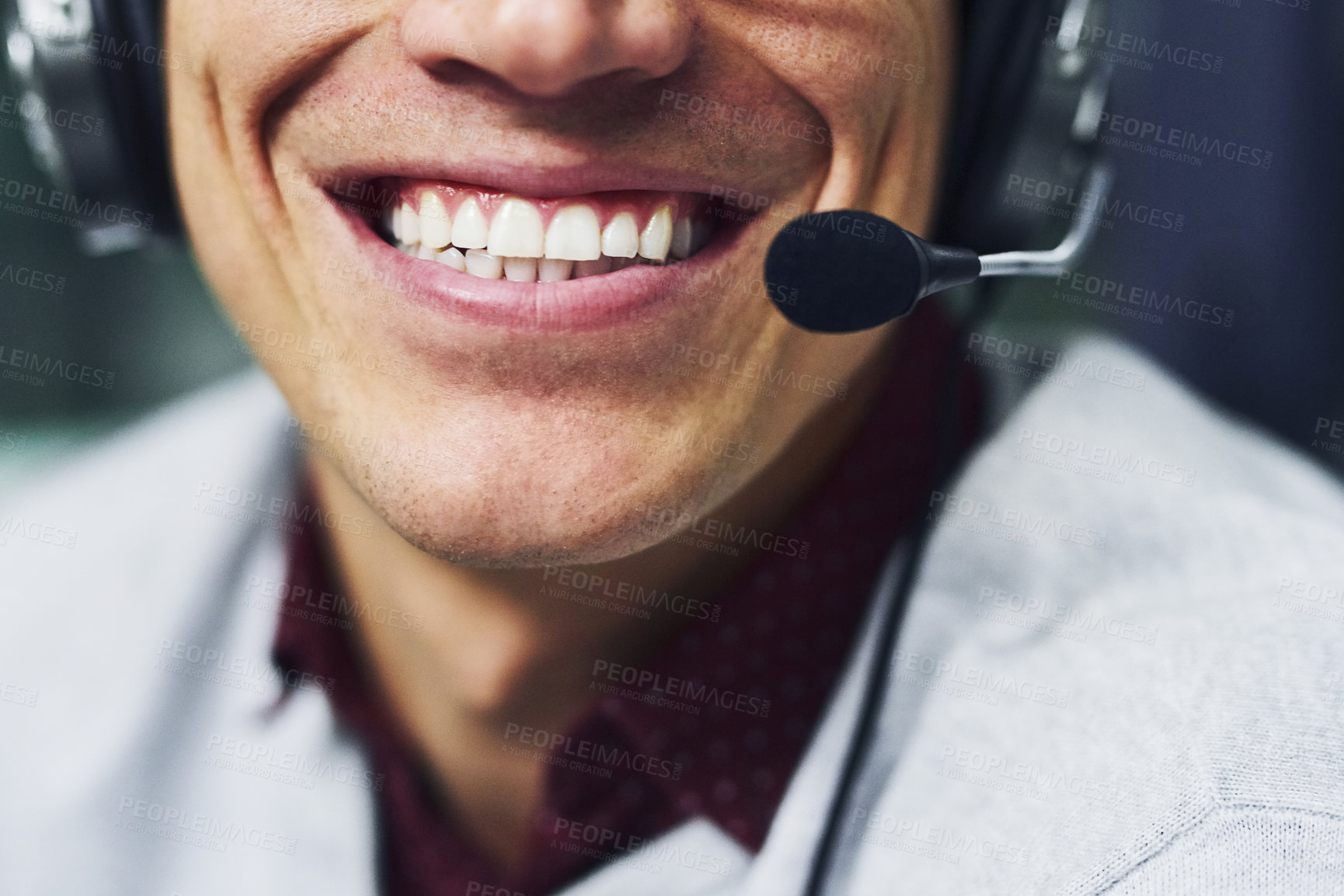 Buy stock photo Closeup shot of an unidentifiable call centre agent working late in an office