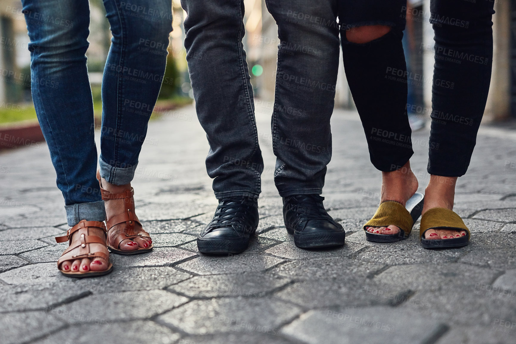 Buy stock photo Walking, feet or people on sidewalk in street, closeup and urban town for shopping to explore outdoors. Group, footwear and legs of friends on pavement outside in city with sandals, fashion or shoes