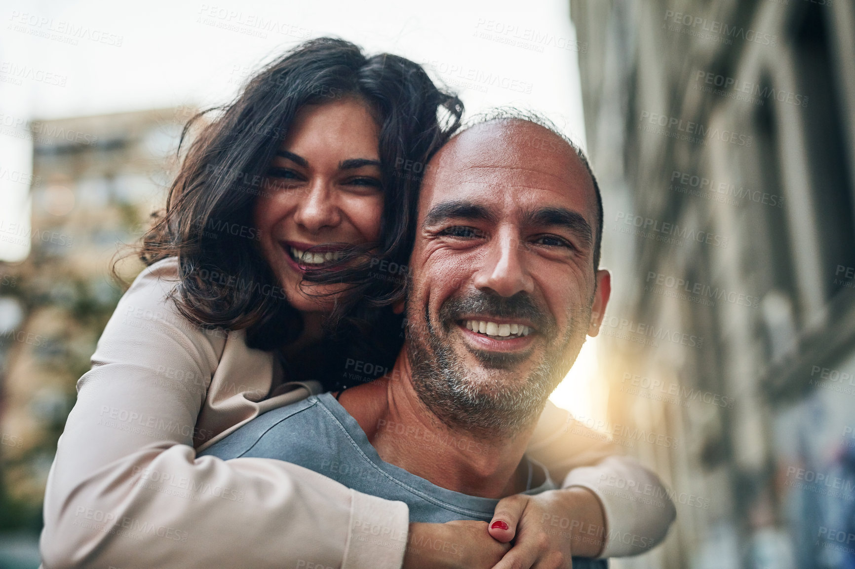 Buy stock photo Portrait, happy couple and piggyback in city for love, vacation or travel for holiday. Mature man, support or carry woman in New York for milestone celebration, anniversary or playful energy for care