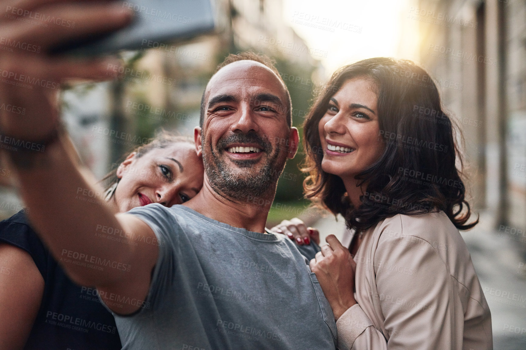 Buy stock photo Selfie, people and happy in city for travel, vacation or support on holiday. Mature man, women and smile for photography with polyamorous relationship, trust and care in New York for romance or love