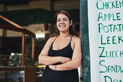 Buy stock photo Cropped shot of a young woman working in her bakery