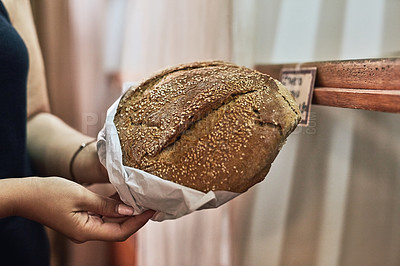 Buy stock photo Baker hands, fresh bread and package in bakery for takeaway, customer order and sale in service industry. Person, sourdough and paper bag at shelf for choice, option or artisanal loaf in restaurant