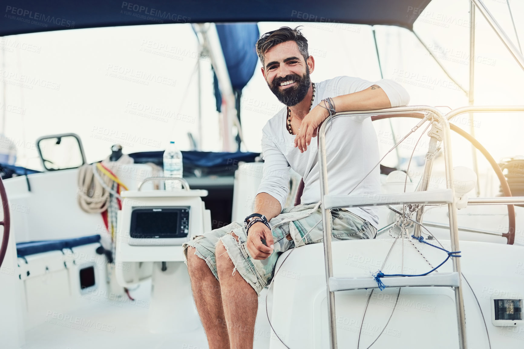 Buy stock photo Cropped shot of a handsome mature man on his yacht