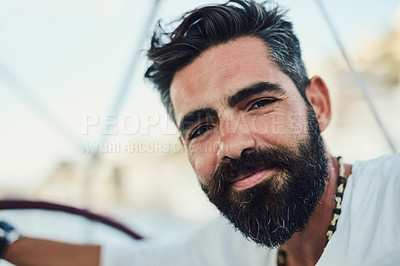 Buy stock photo Cropped shot of a handsome mature man on his yacht