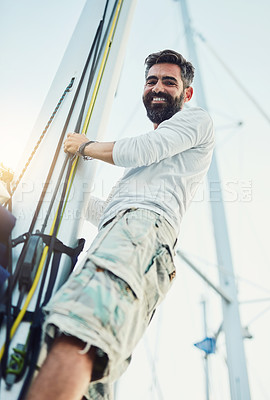 Buy stock photo Cropped shot of a handsome mature man on his yacht