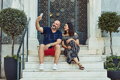 Buy stock photo Outdoor, couple and happy with selfie on stairs for social media post and profile picture in Spain. People, relationship and smile or satisfied with memories for bonding, support and care on break