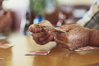 Buy stock photo Card, game and person hands in retirement home with senior care, playing and fun on table. Cognitive, memory and activity in group with calm hobby, relax and poker for brain engagement and support