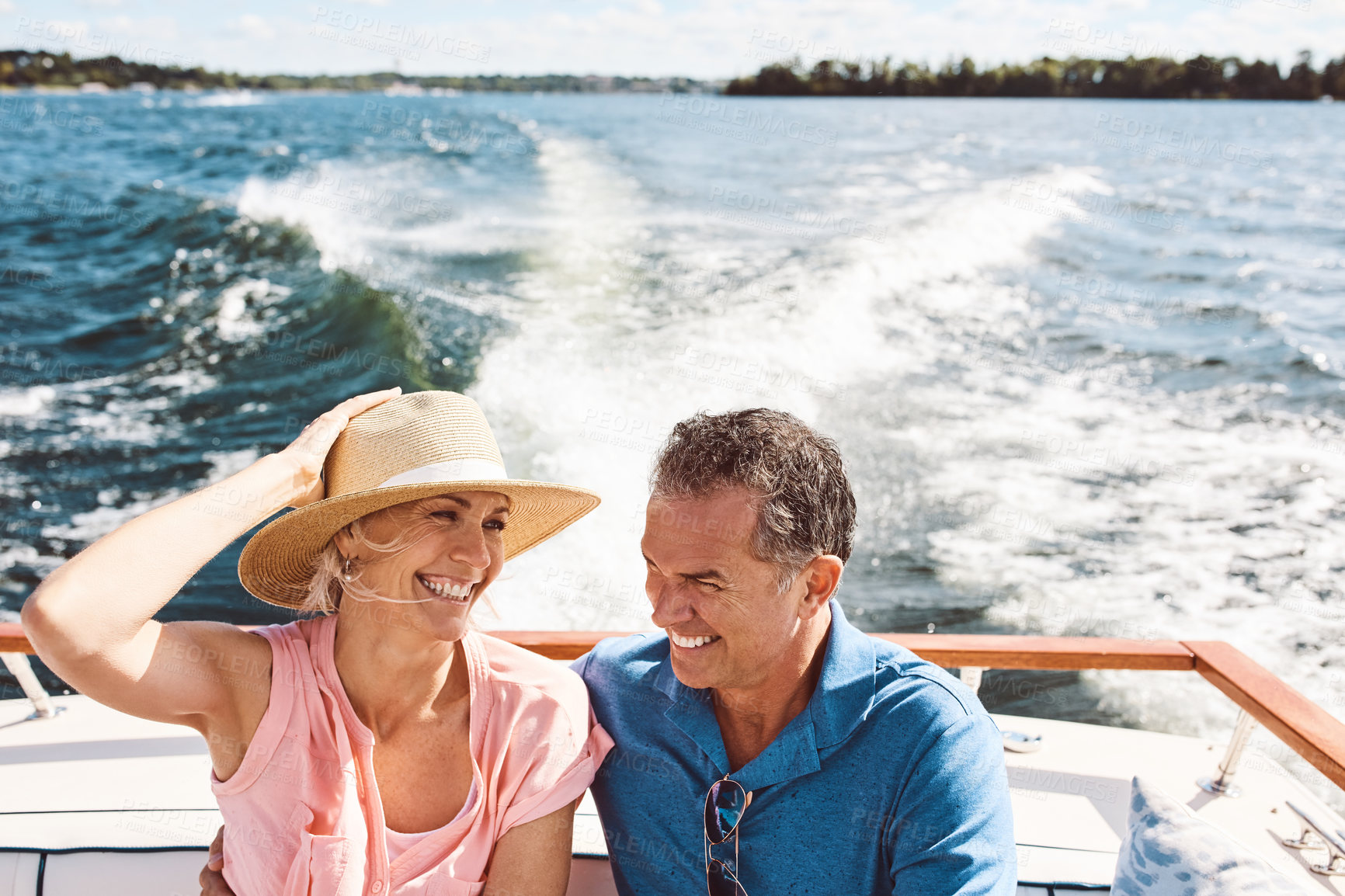 Buy stock photo Ocean, happy couple and on a boat for retirement travel, summer freedom and holiday in Bali. Smile, love and a senior man and woman on a yacht for vacation adventure, luxury and a cruise date