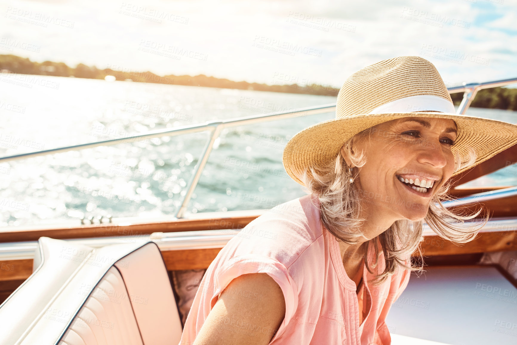 Buy stock photo Travel, journey and happy with mature woman on boat for sailing, adventure and summer vacation. Smile, fun and excited with tourist and relaxing on deck of yacht for tropical, cruise and holiday