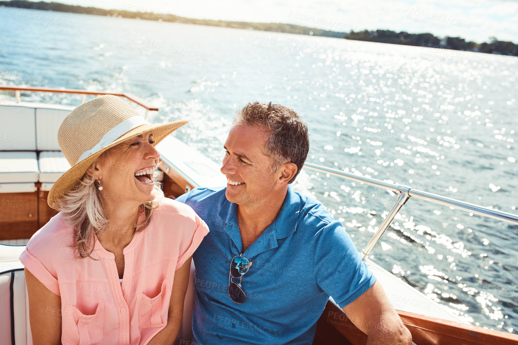 Buy stock photo Boat, cruise and laughing with mature couple at sea together for holiday, getaway or vacation for anniversary. Smile, travel or yacht with funny man and woman on water for bonding, romance or voyage