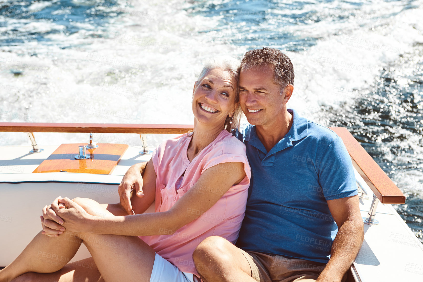 Buy stock photo Mature couple, happy and boat cruise for holiday, bonding or retirement on ocean sailing with relax. Man, woman and hug on luxury yacht at sea for love, vacation or tropical adventure by Bahamas