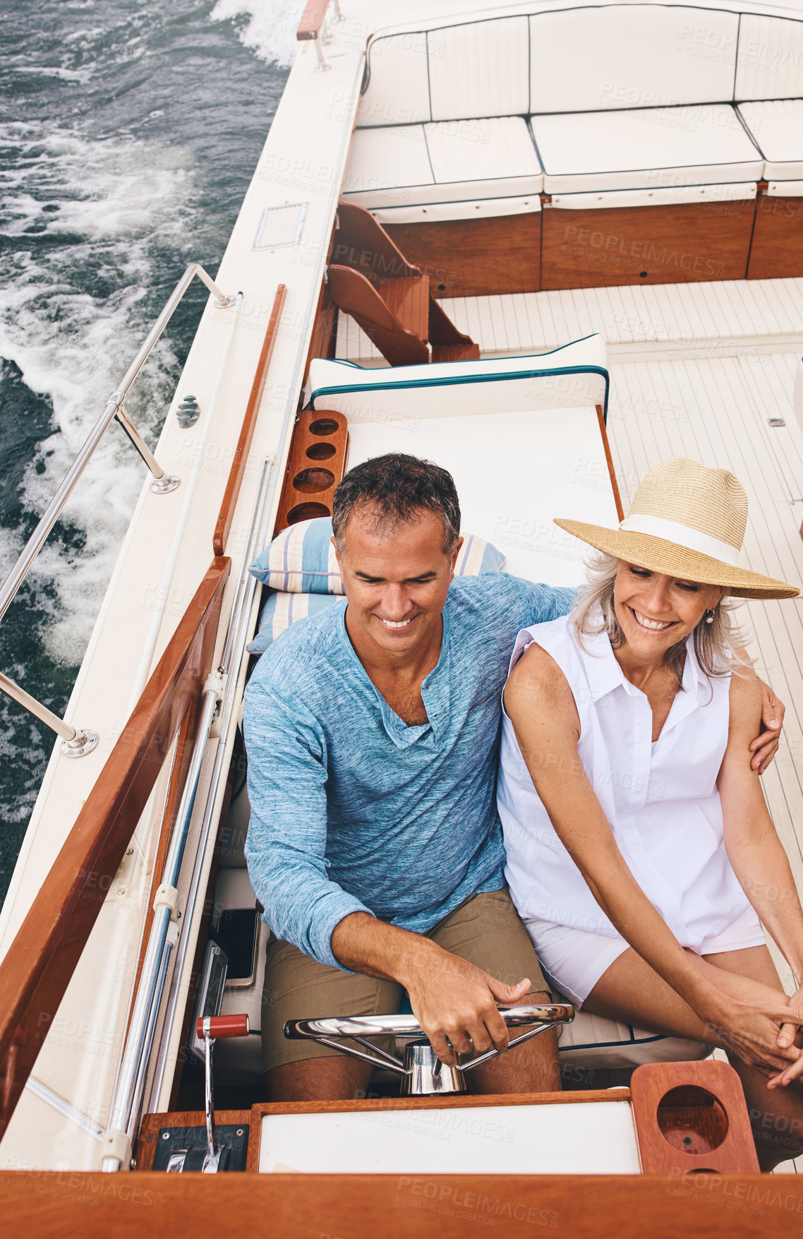 Buy stock photo Boat, holiday and romance with mature couple on ocean or sea from above for travel and vacation. Date, love or luxury with man and woman riding in yacht together for adventure, journey or trip