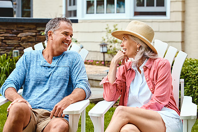 Buy stock photo Mature couple, lawn and relax on deck chair with funny conversation, bonding and care in summer at house. Man, woman and happy with laughing at comic memory, talk or chat on grass in backyard garden