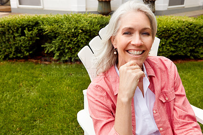 Buy stock photo Shot of a senior woman spending her day outside 