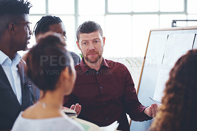 Buy stock photo Shot of a group of businesspeople brainstorming in an office