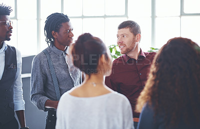 Buy stock photo Shot of a group of businesspeople brainstorming in an office