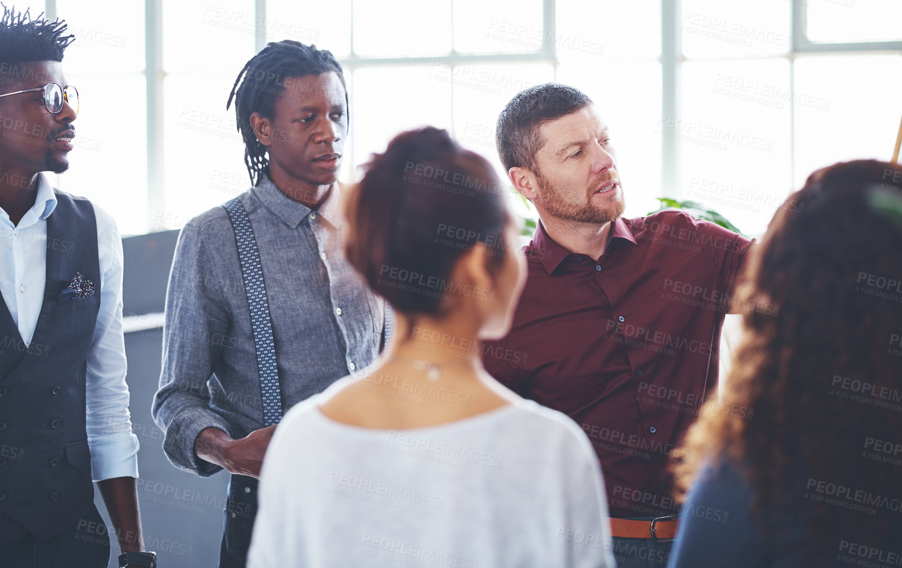 Buy stock photo Shot of a group of businesspeople brainstorming in an office