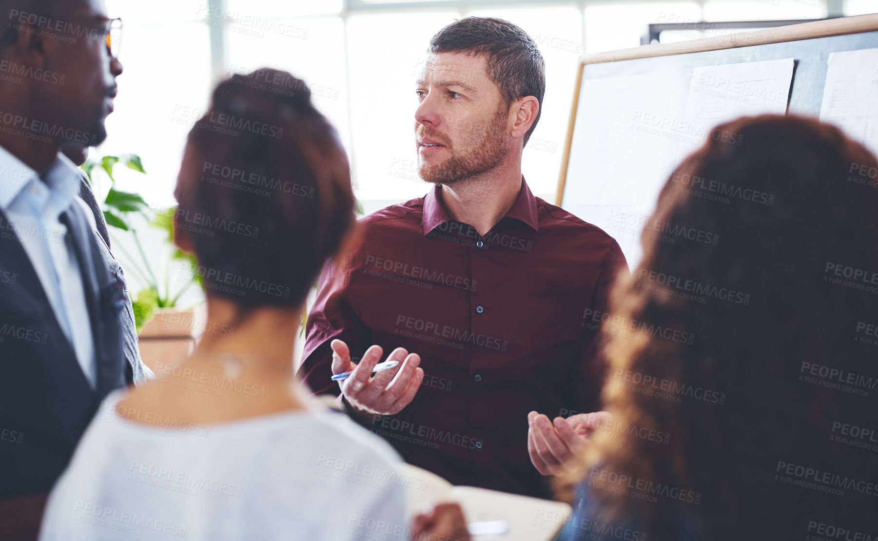 Buy stock photo Shot of a group of businesspeople brainstorming in an office