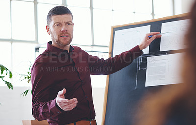Buy stock photo Shot of a businessman giving a presentation in an office