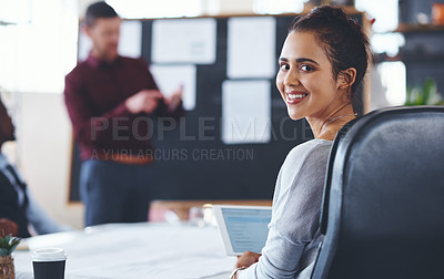 Buy stock photo Portrait of a young businesswoman using a digital tablet during a meeting in an office