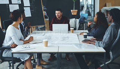 Buy stock photo Cropped shot of a group of creative businesspeople meeting in their office