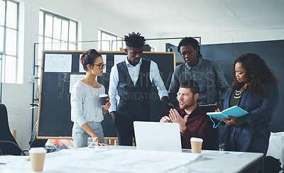 Buy stock photo Cropped shot of a group of creative businesspeople meeting in their office