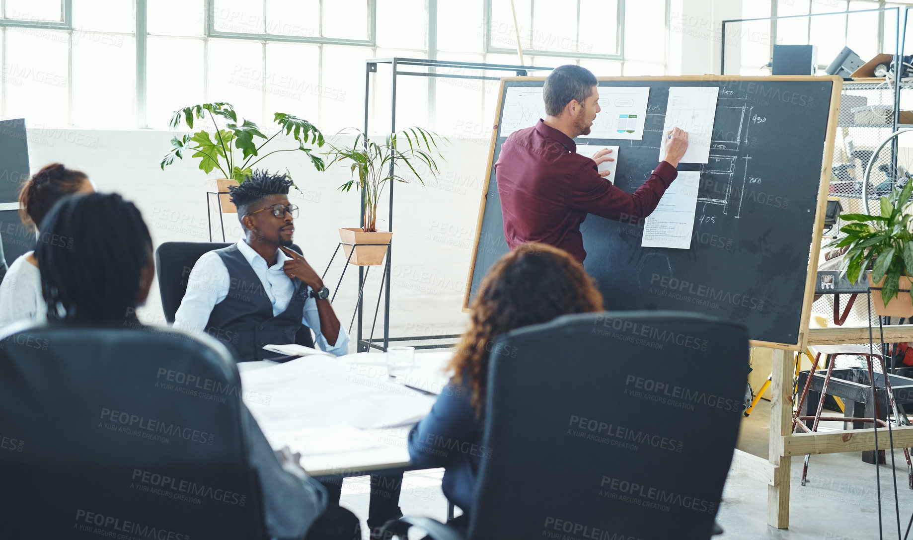 Buy stock photo Cropped shot of a young creative businessman doing a presentation in the office