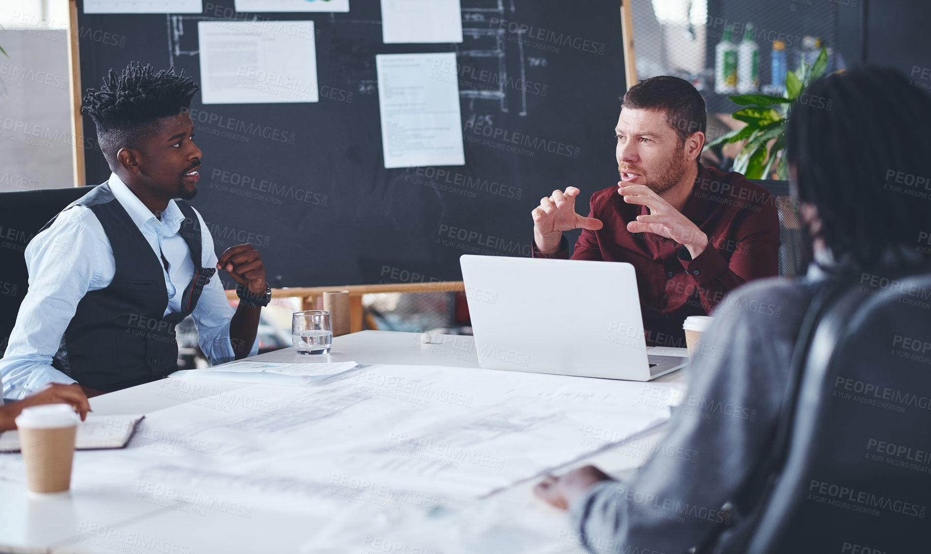 Buy stock photo Cropped shot of a group of creative businesspeople meeting in their office