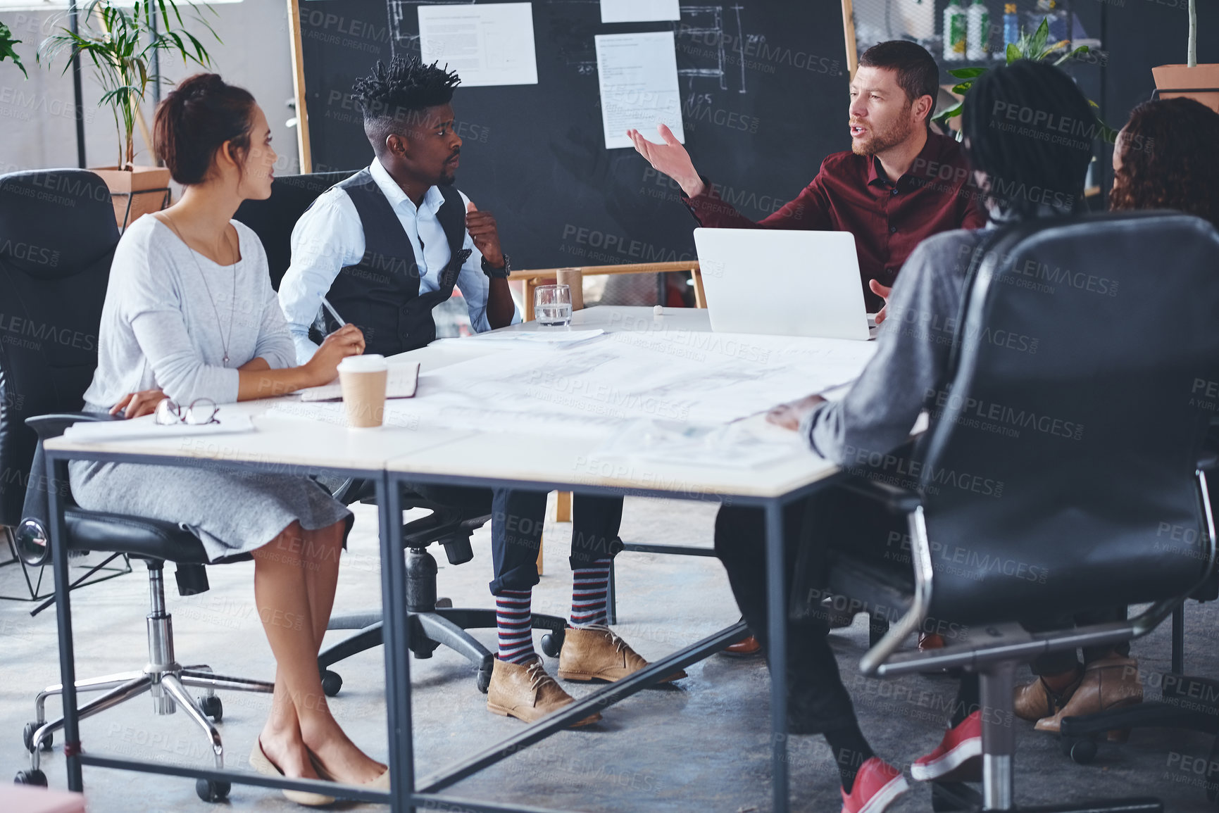 Buy stock photo Cropped shot of a group of creative businesspeople meeting in their office