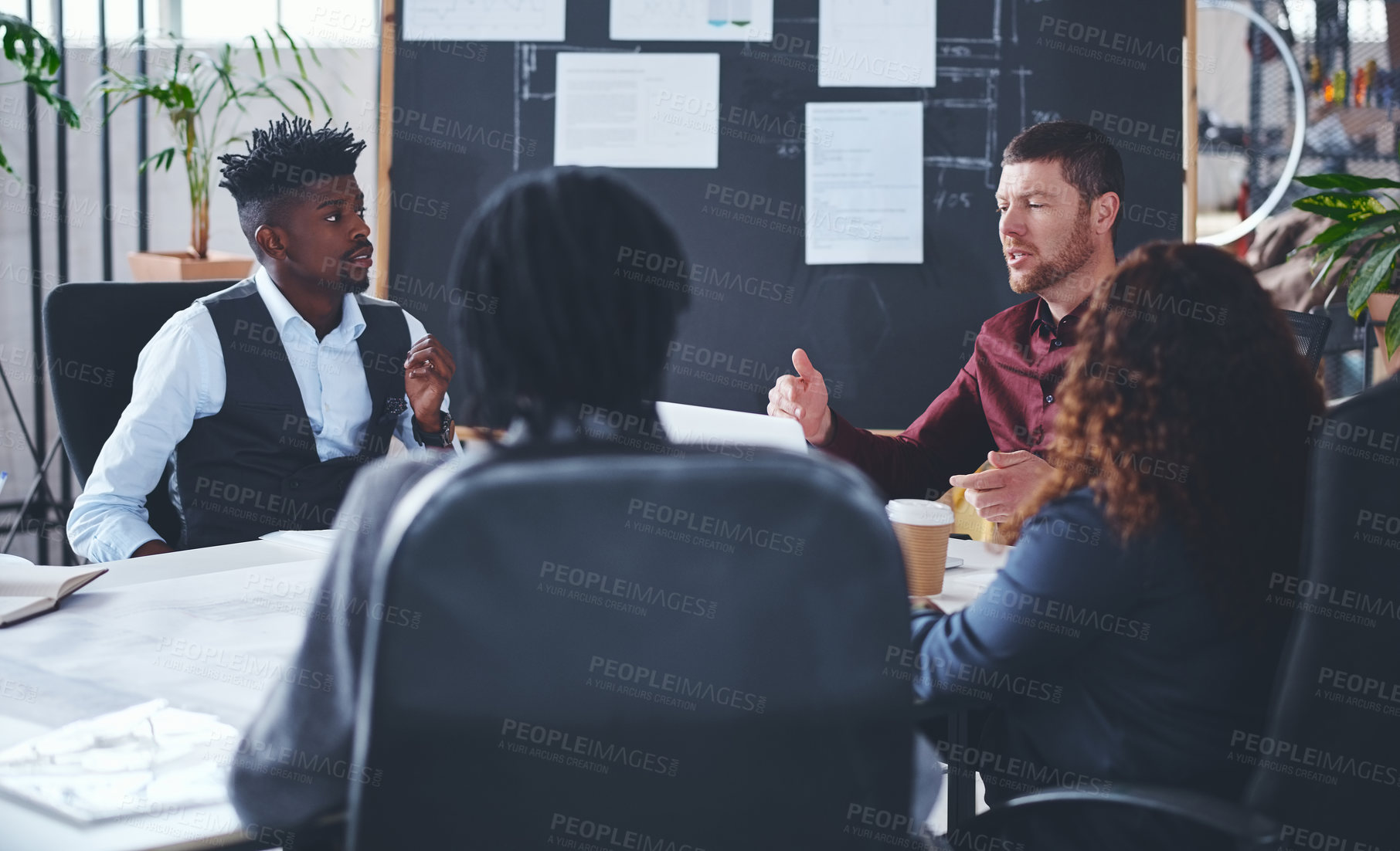 Buy stock photo Cropped shot of a group of creative businesspeople meeting in their office