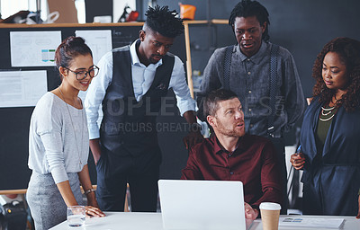 Buy stock photo Cropped shot of a group of creative businesspeople meeting in their office