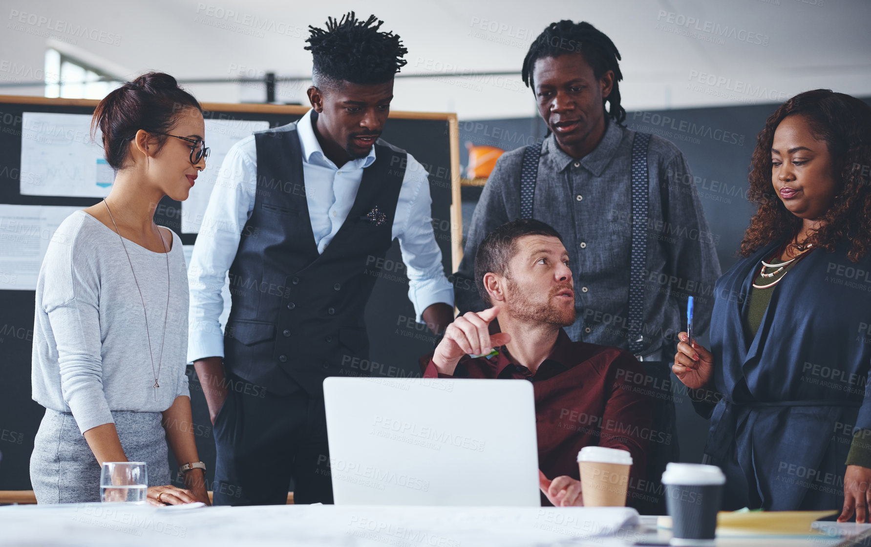 Buy stock photo Cropped shot of a group of creative businesspeople meeting in their office