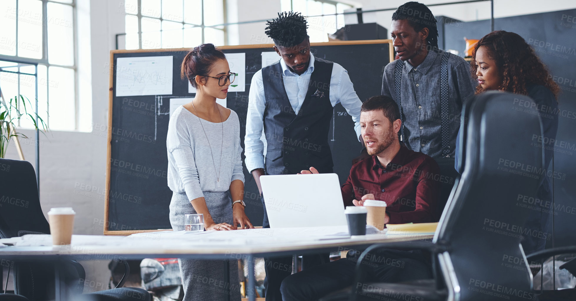 Buy stock photo Cropped shot of a group of creative businesspeople meeting in their office