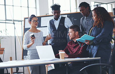 Buy stock photo Cropped shot of a group of creative businesspeople meeting in their office