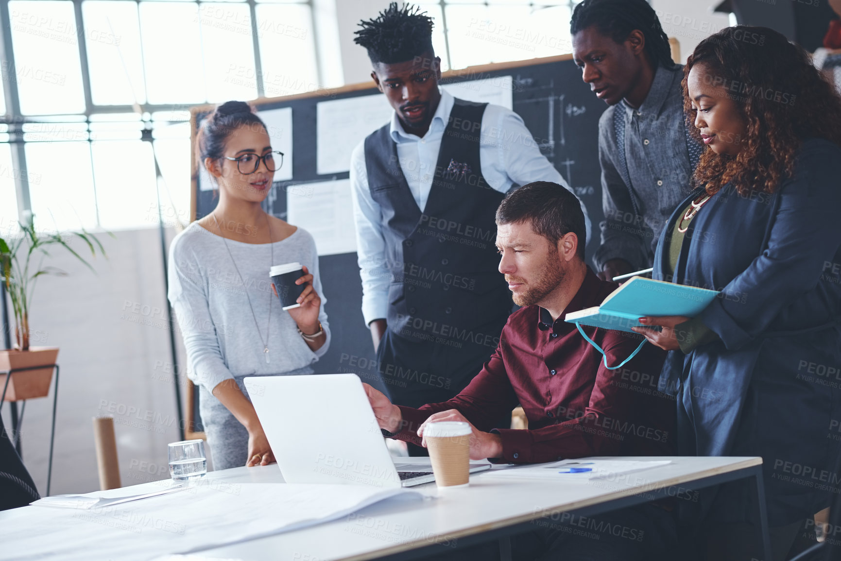 Buy stock photo Cropped shot of a group of creative businesspeople meeting in their office