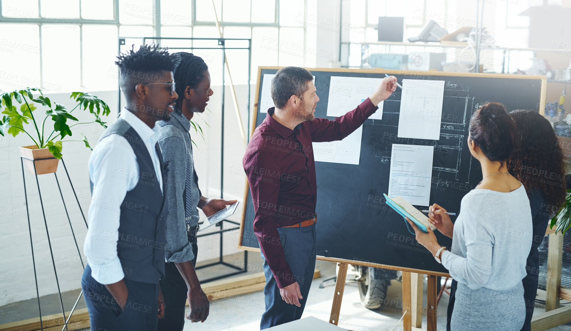 Buy stock photo Cropped shot of a young creative businessman doing a presentation in the office