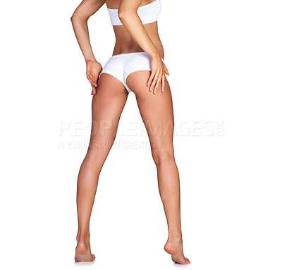 Buy stock photo Buttocks, legs and underwear with a model woman in studio isolated on a white background for skincare. Bum, panties and body with a female standing on blank mockup space to promote fitness or health