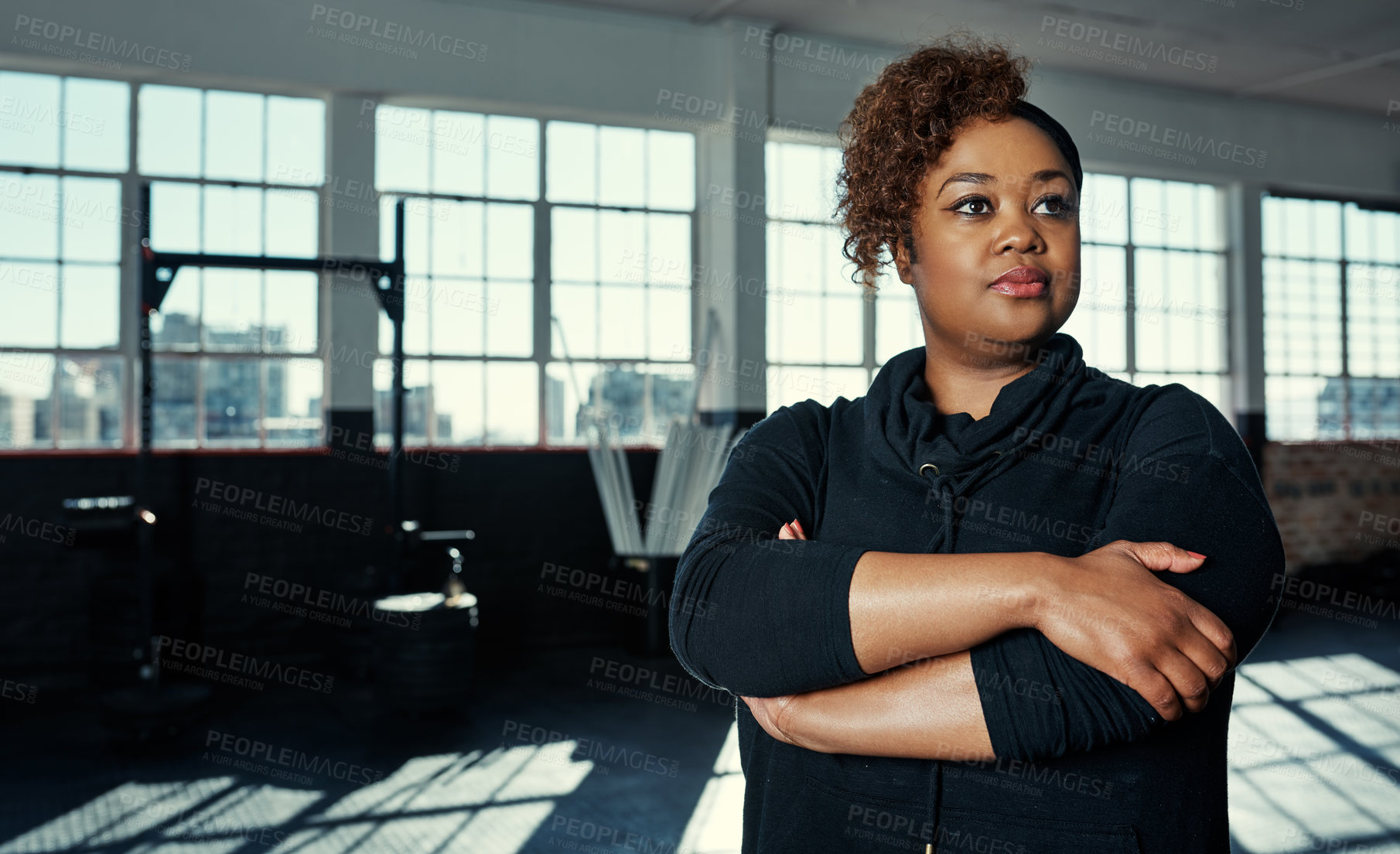 Buy stock photo Portrait of a young woman in a gym