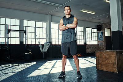 Buy stock photo Shot of a young man in a gym