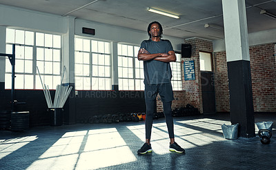 Buy stock photo Shot of a young man in a gym