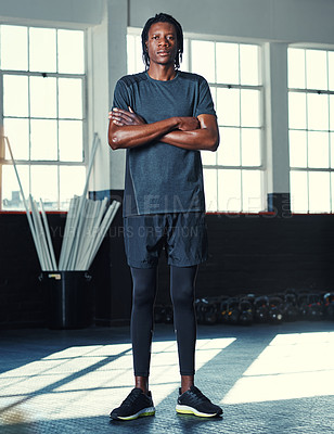 Buy stock photo Shot of a young man in a gym