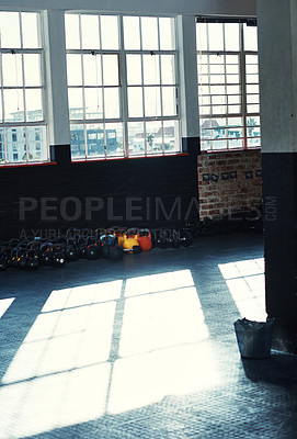 Buy stock photo Shot of exercise equipment in a gym with no people