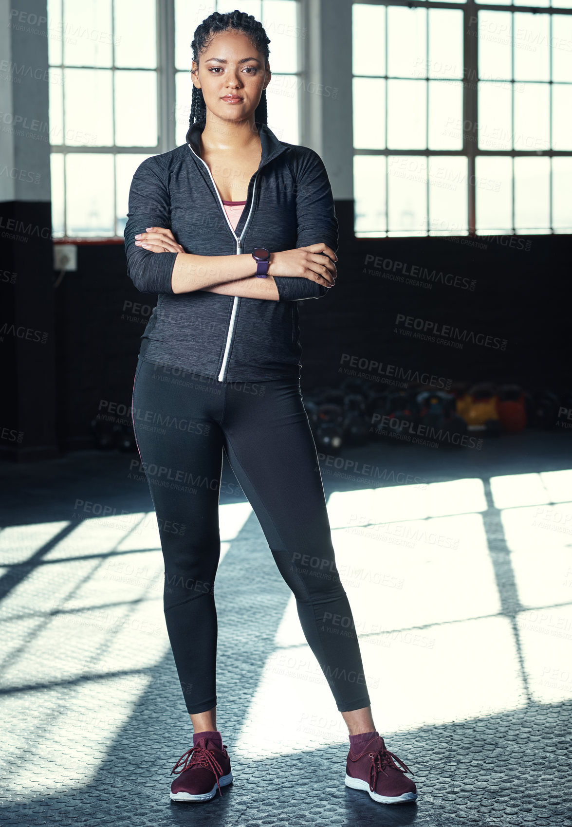 Buy stock photo Shot of a young woman in a gym